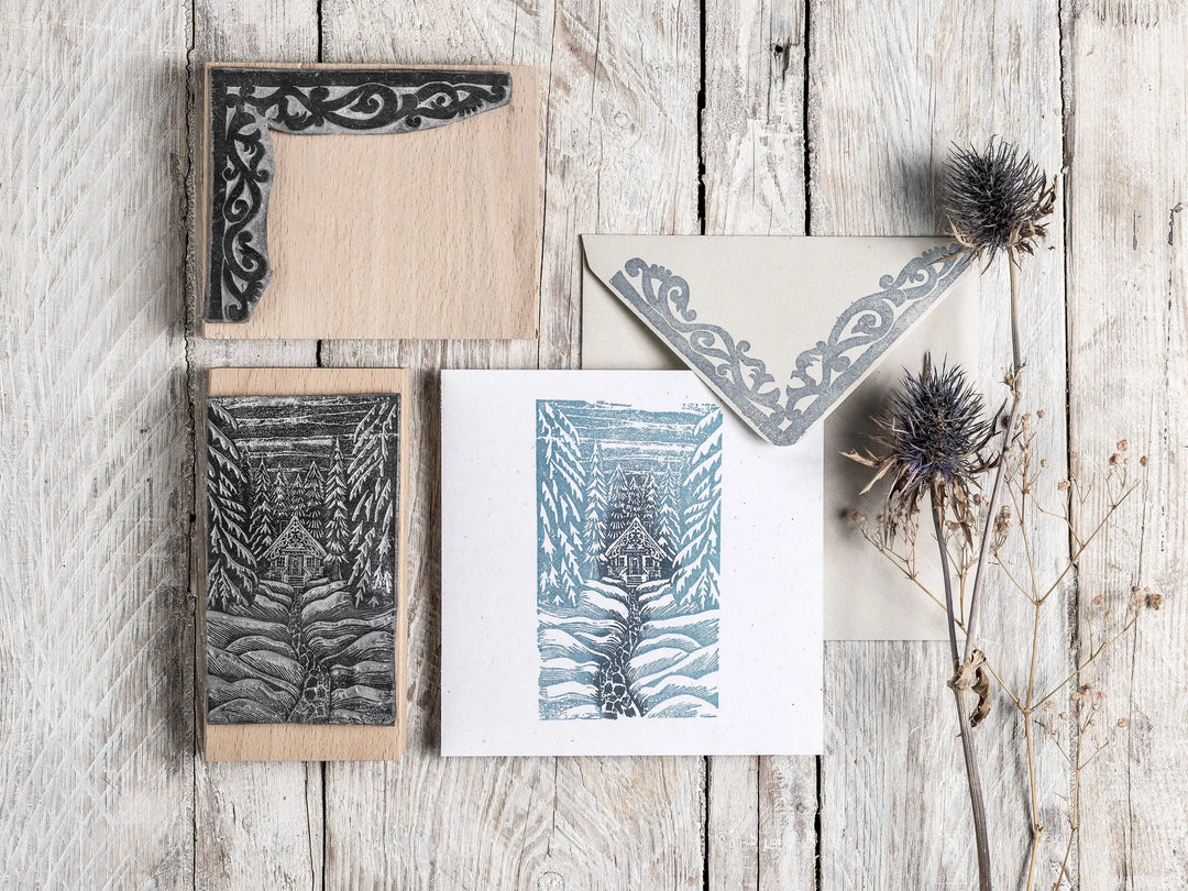 The Cosy Cabin in the Forest Christmas rubber stamp set by Noolibird — snowy woodland cabin lino cut for card making